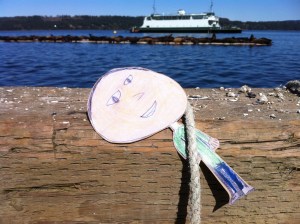 Flat Mark holds onto a rope on the government dock at Fanny Bay while watching the sea lions.